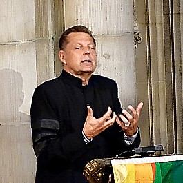 Portrait of Rev Pfleger speaking at Historic Riverside Church NYC 953px by 720px